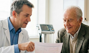 Physician shows a patient an Advanced Beneficiary Notice form for signing before ordering lab tests.
